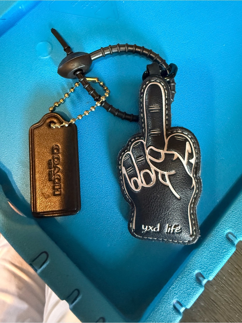 Coach Black Leather Middle Finger Keychain for women’s Accessories.